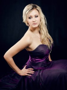 a woman wearing purple dress